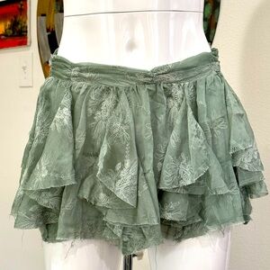 Free People pale green embroidered fairy mini skirt. Ruffled, flowy, rough hem.